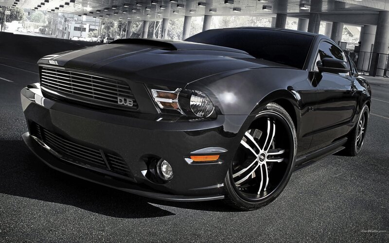 black ford mustang on asphalt