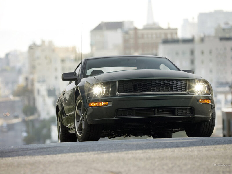 black ford mustang on city street