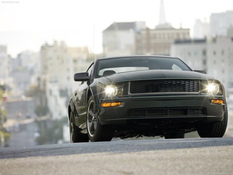black ford mustang on city street