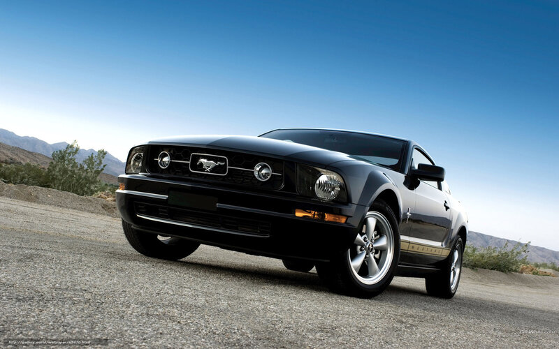 Black Ford Mustang on desert road