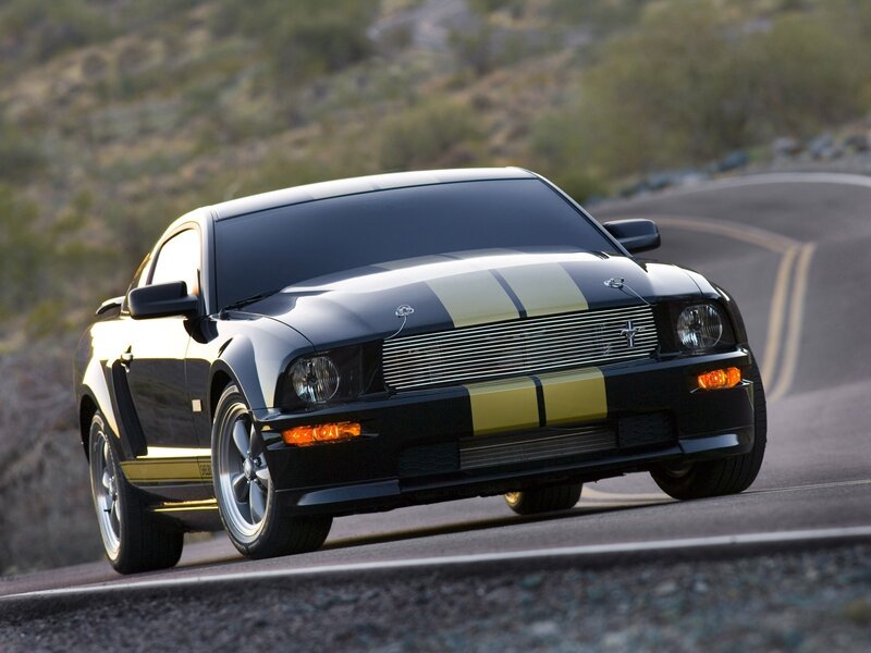 Black Ford Mustang on winding road