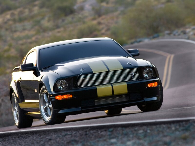 Black Ford Mustang on winding road
