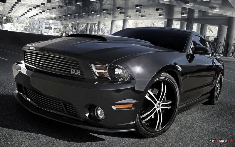 Black Ford Mustang under overpass