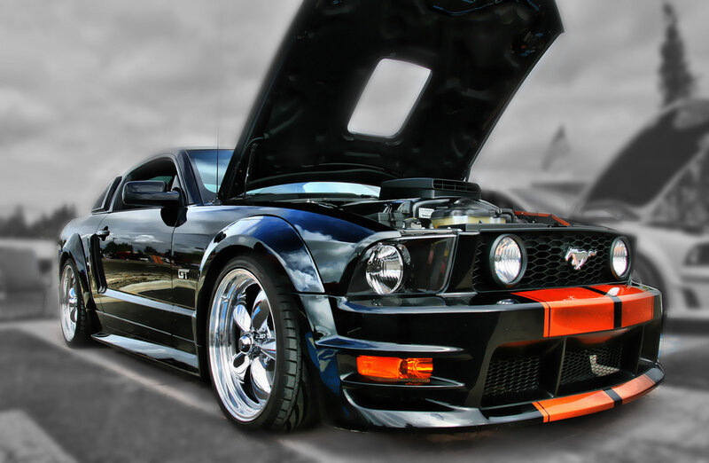 Black Ford Mustang with open hood