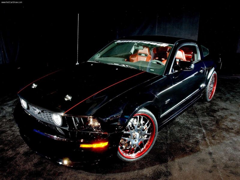 black ford mustang with red accents