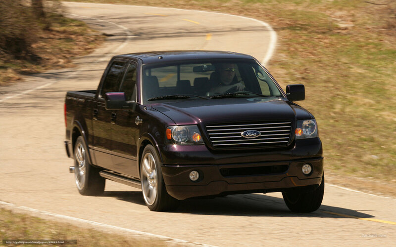 black Ford pickup on road