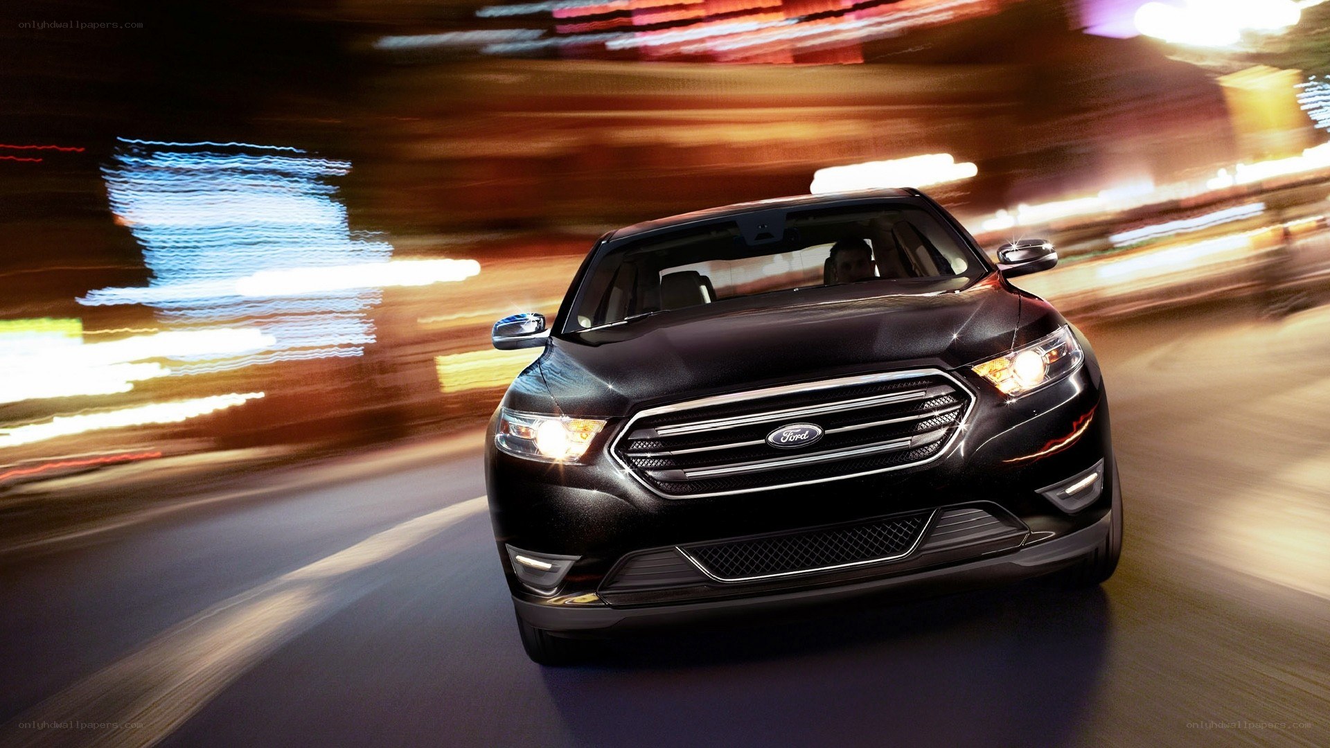 black ford sedan at night