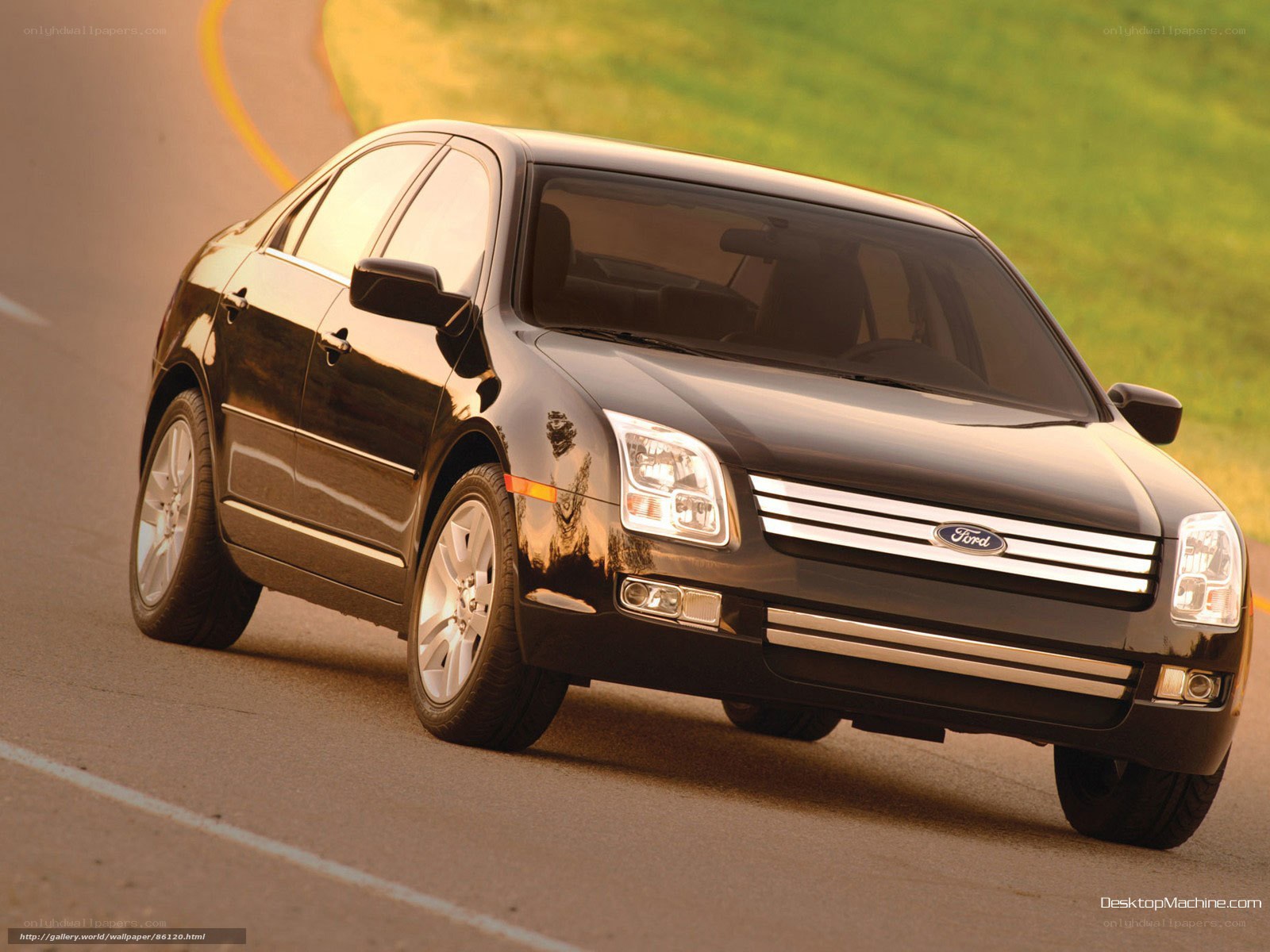 black ford sedan on road