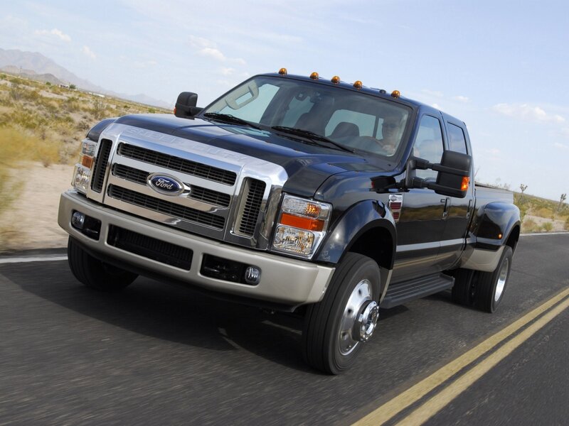 Black Ford Super Duty truck on road