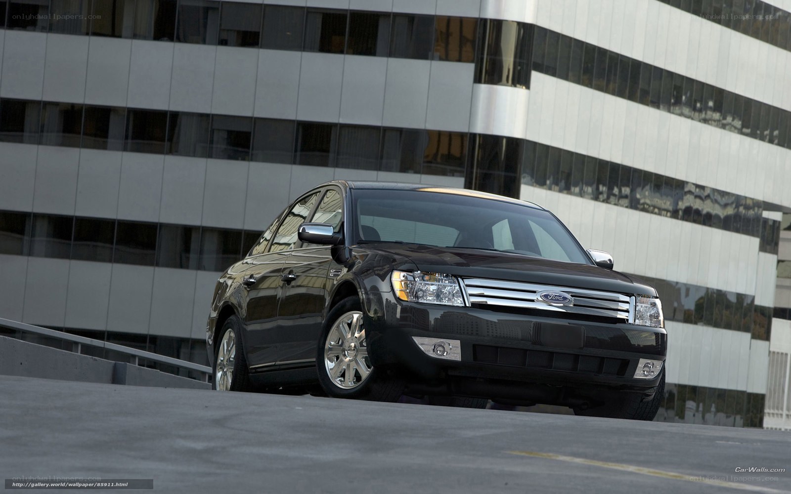 Black Ford Taurus in urban setting