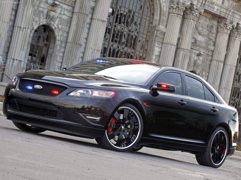 Black Ford Taurus police car