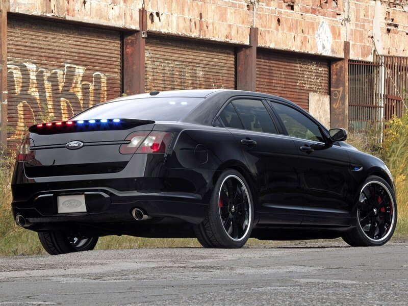 black ford taurus police car