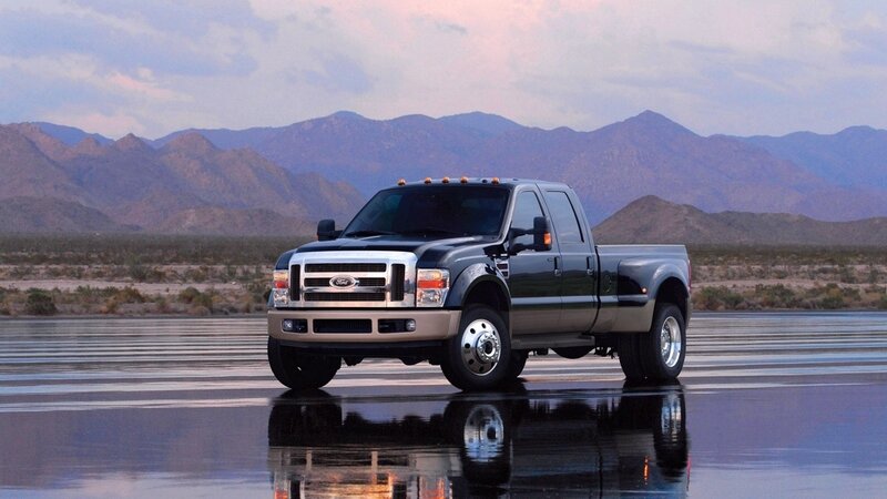 black ford truck on wet road