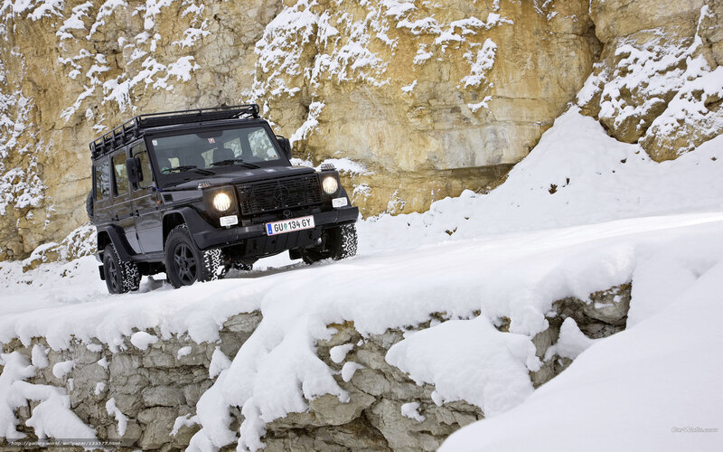 Black G-Wagen on snowy mountain road