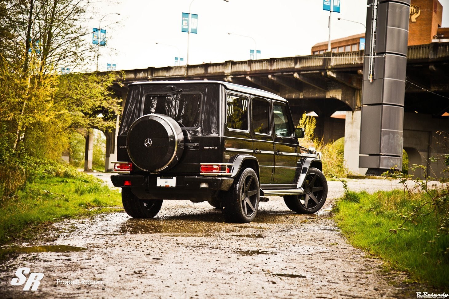Black G-Wagon under a bridge