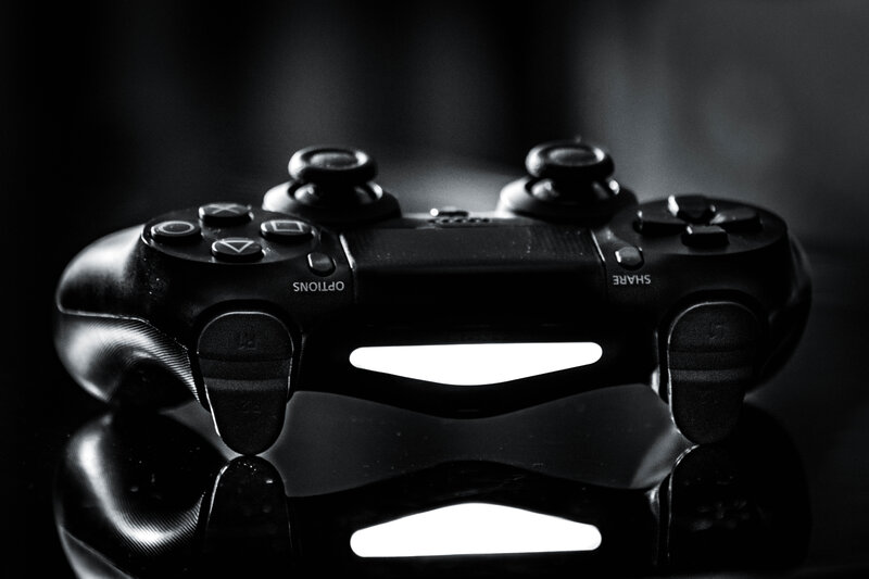 Black Game Controller — Dramatic, Photograph