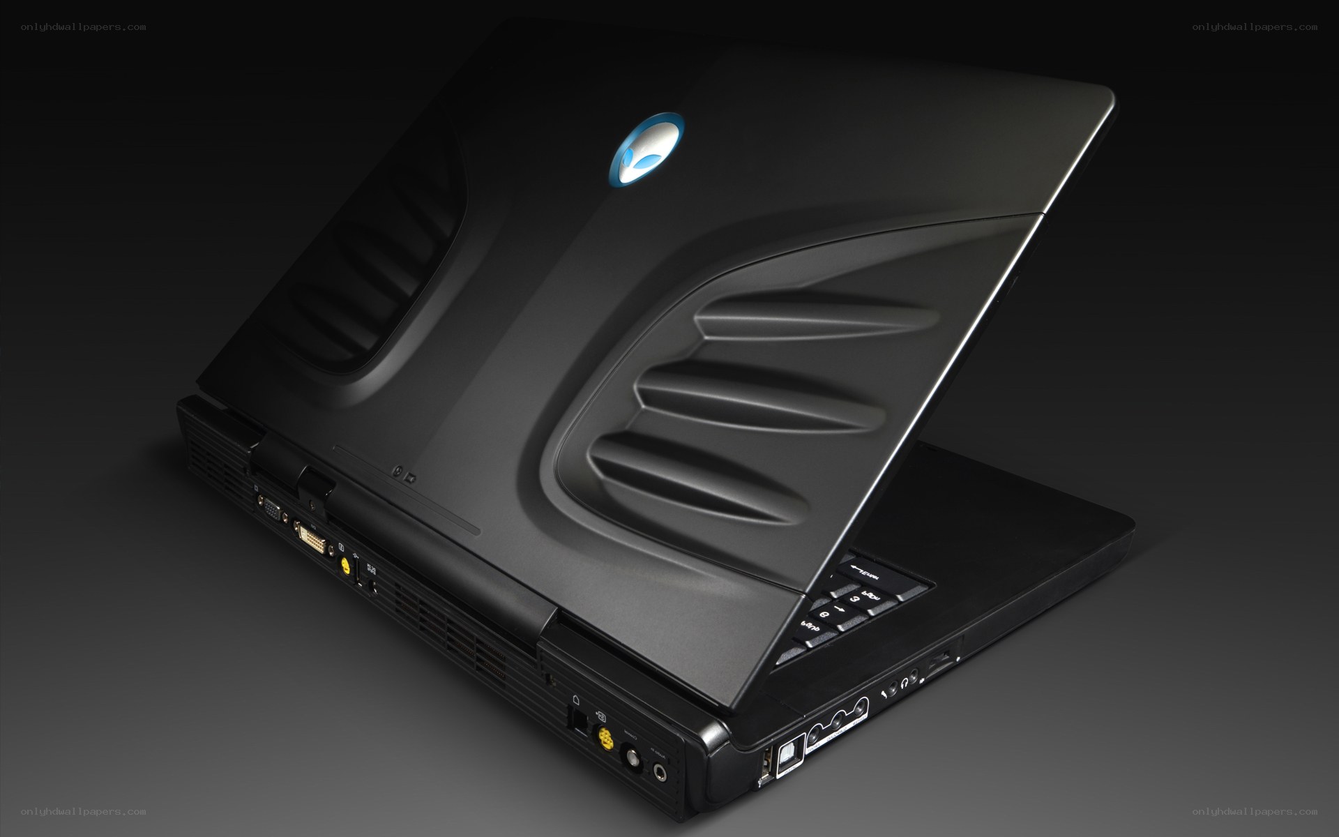 black gaming laptop with alien logo