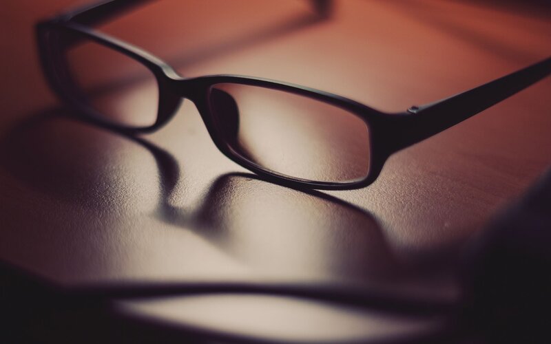 black glasses on a table