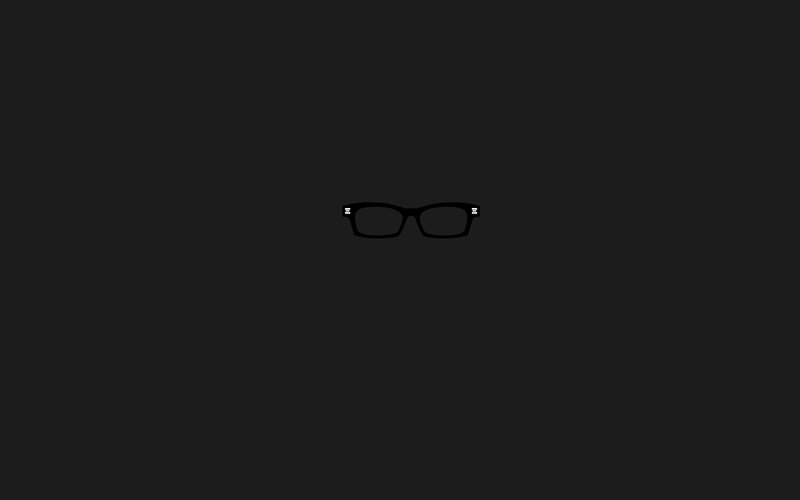black glasses on dark background
