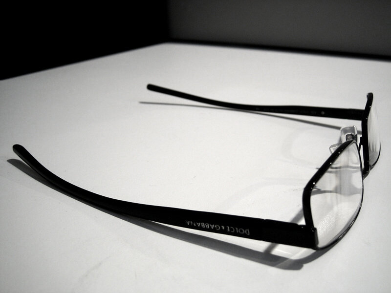 black glasses on white surface