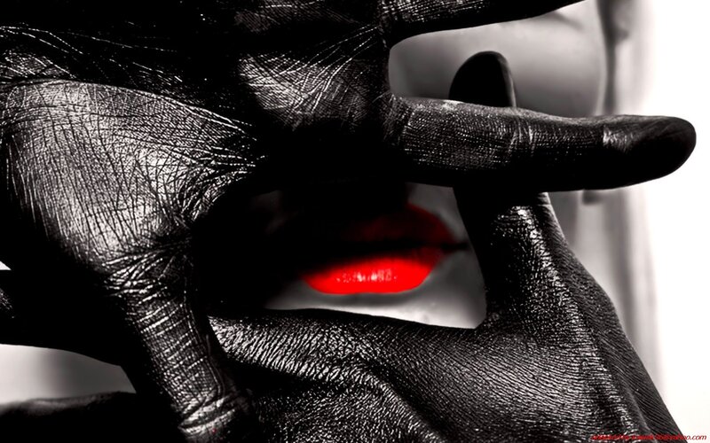 black-gloved hand with red lips