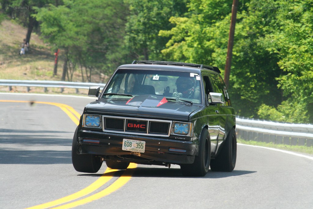black gmc suv on road