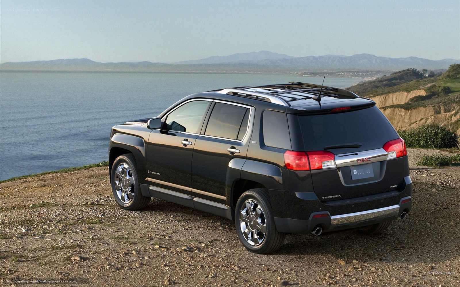 Black GMC Terrain on cliffside