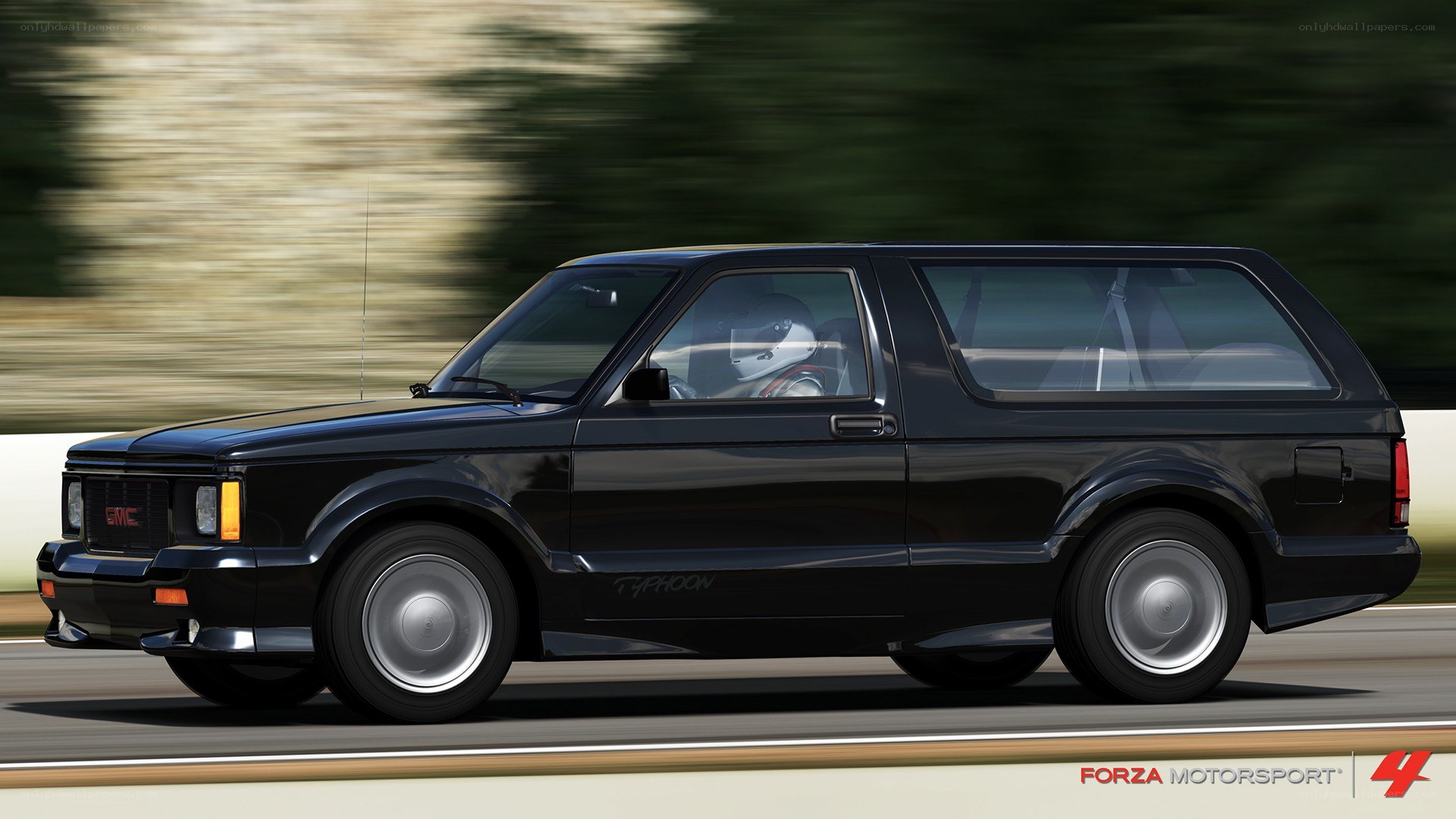 Black GMC Typhoon in motion