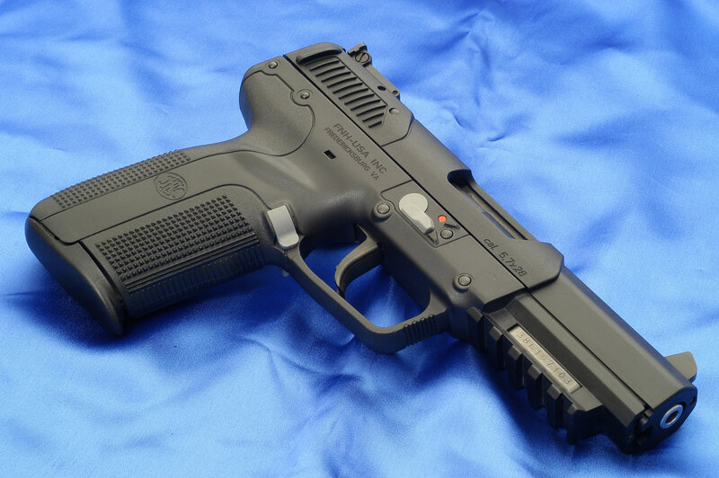 black handgun on blue cloth