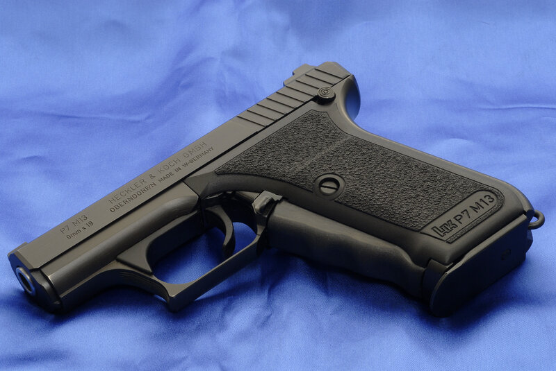 black handgun on blue cloth