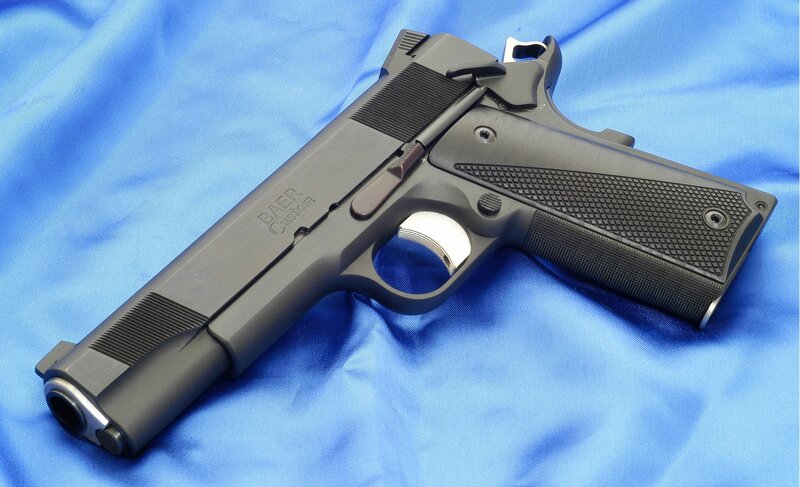 Black handgun on blue cloth