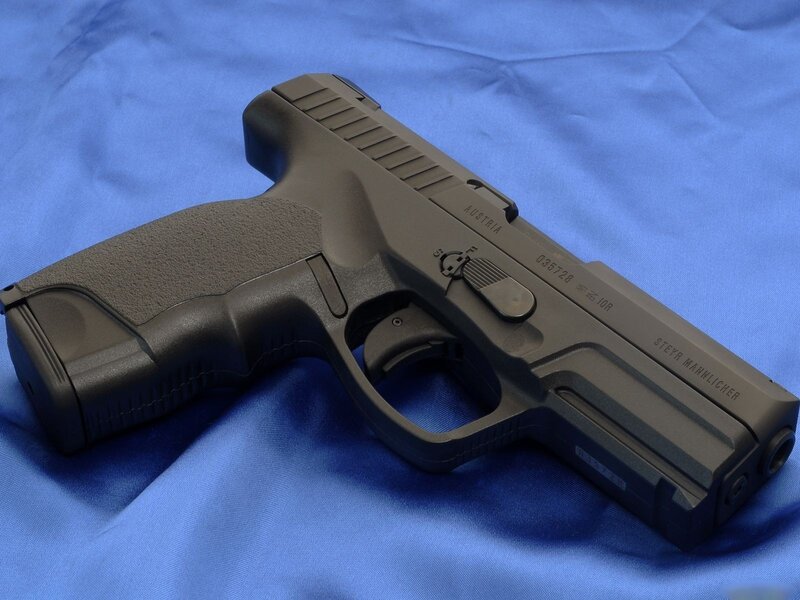 black handgun on blue cloth