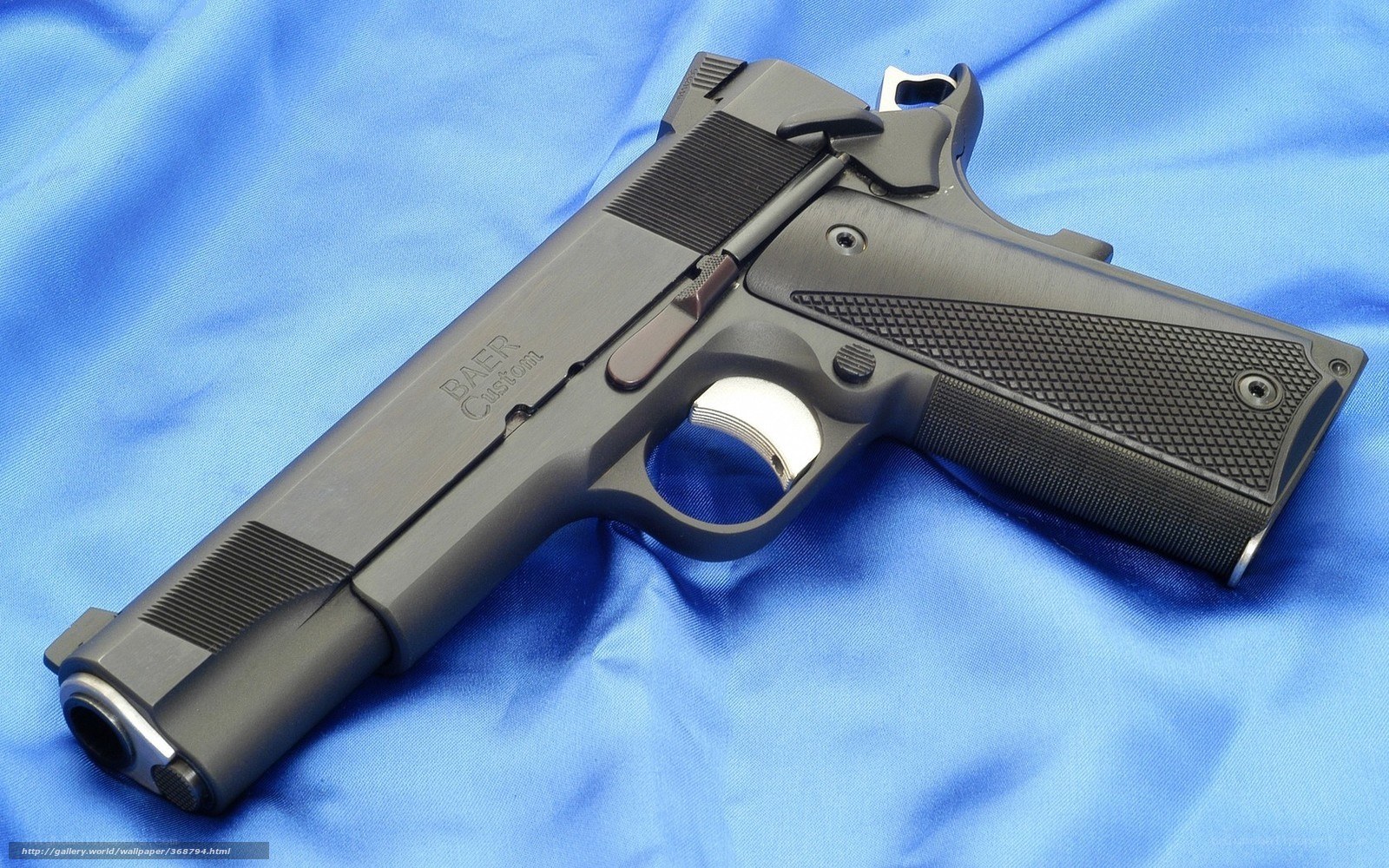 black handgun on blue cloth