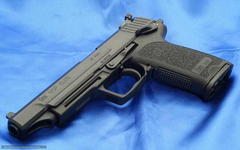Black handgun on blue cloth