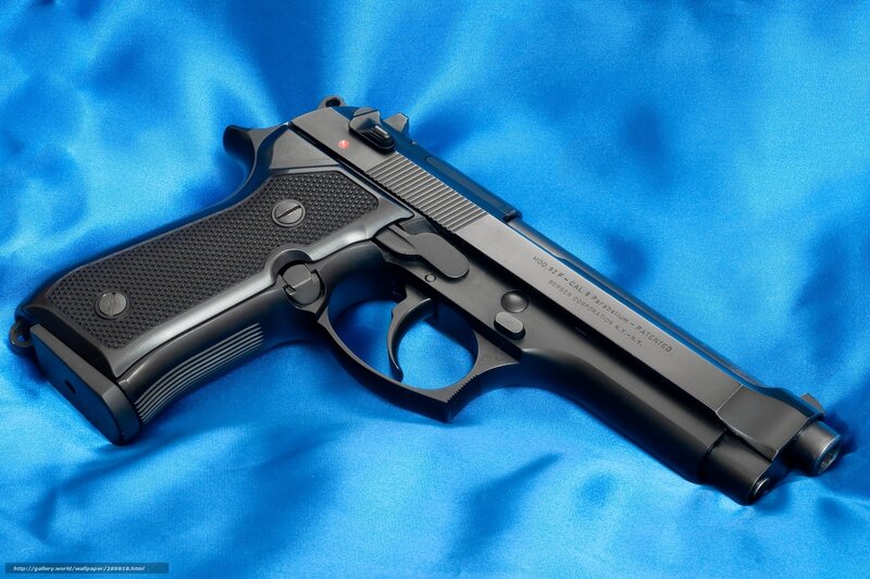 Black Handgun on Blue Fabric — Neutral