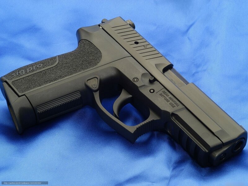 Black Handgun on Blue — Neutral, Photograph