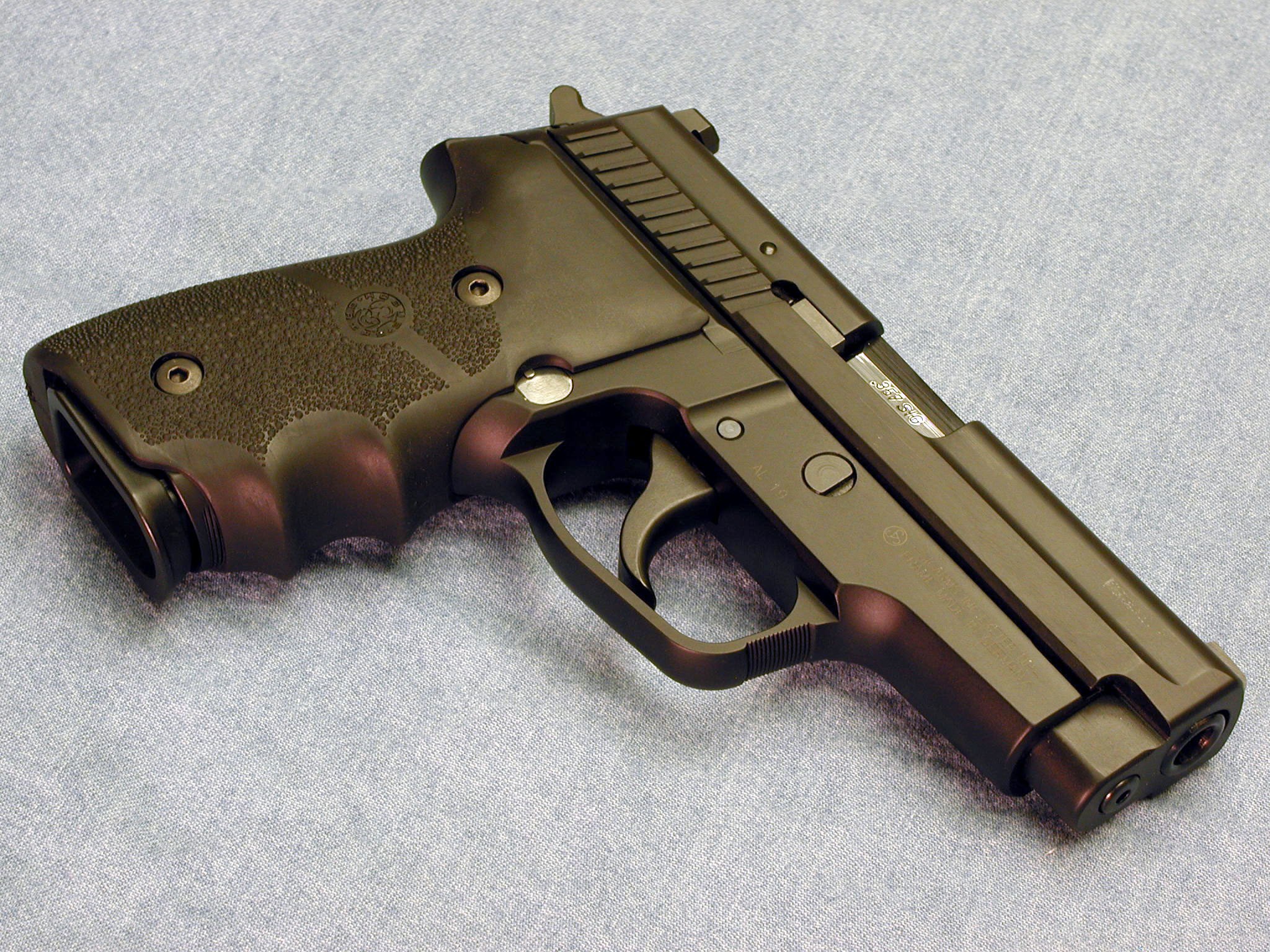 black handgun on fabric