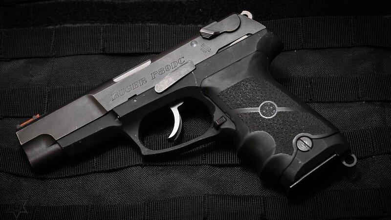 Black Handgun on Fabric — Dramatic, Photograph, Gun