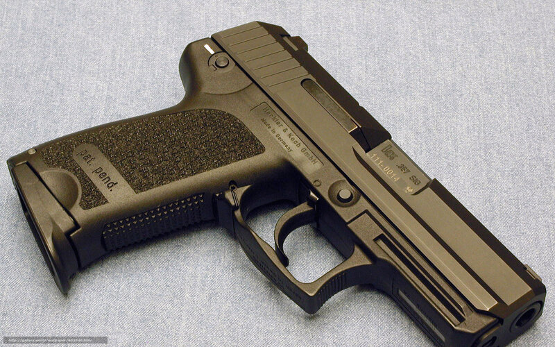 Black Handgun on Fabric — Neutral, Photograph