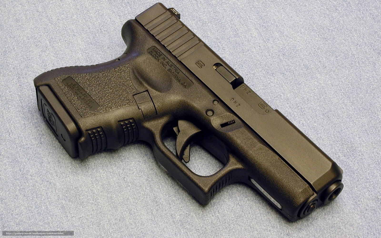 black handgun on fabric