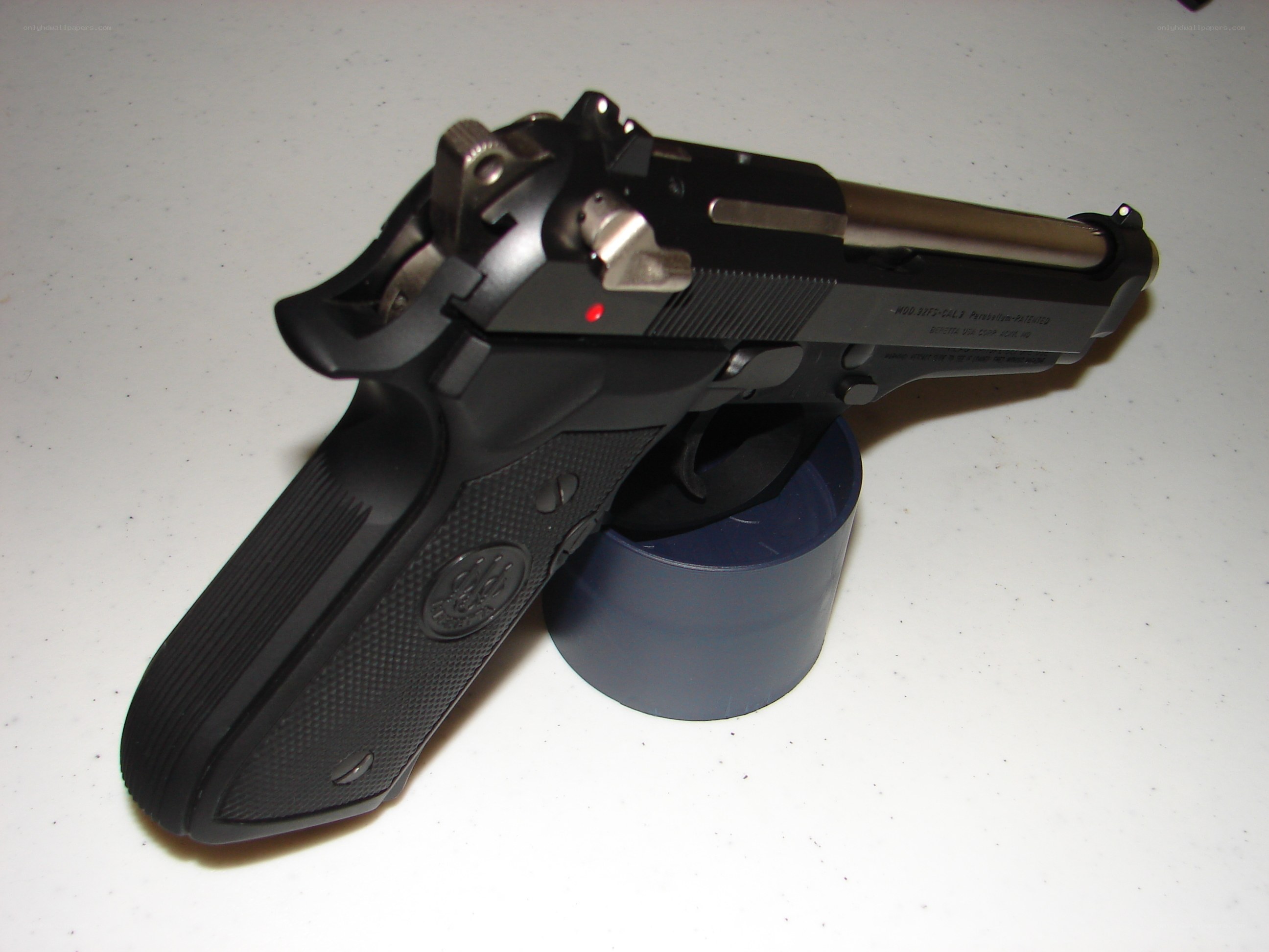 black handgun on stand