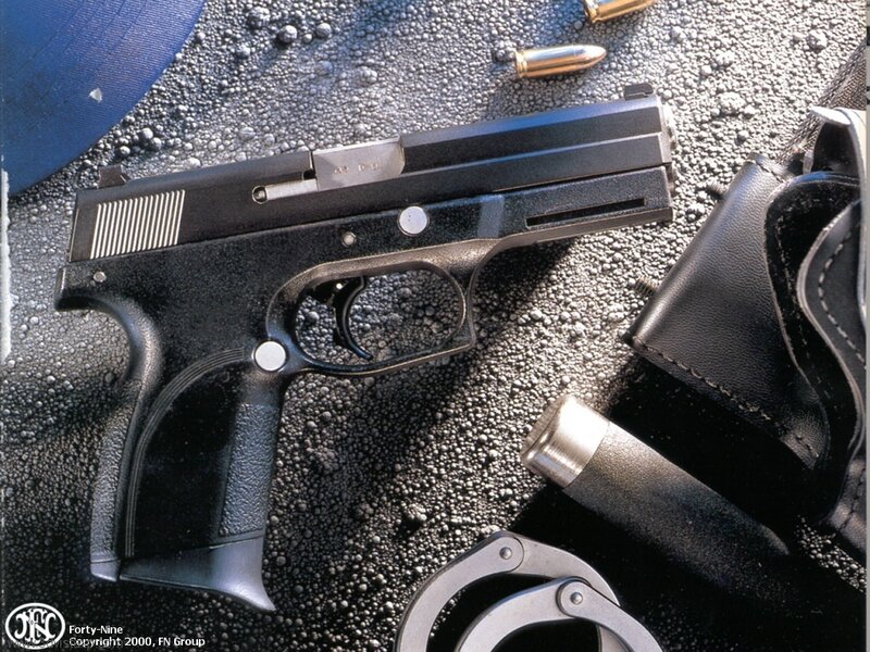 Black Handgun on Surface — Dramatic