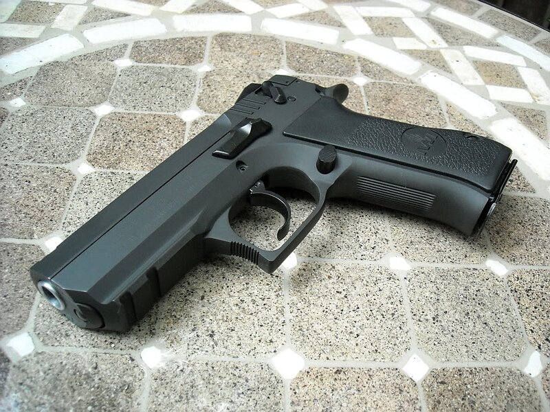 Black Handgun on Tile