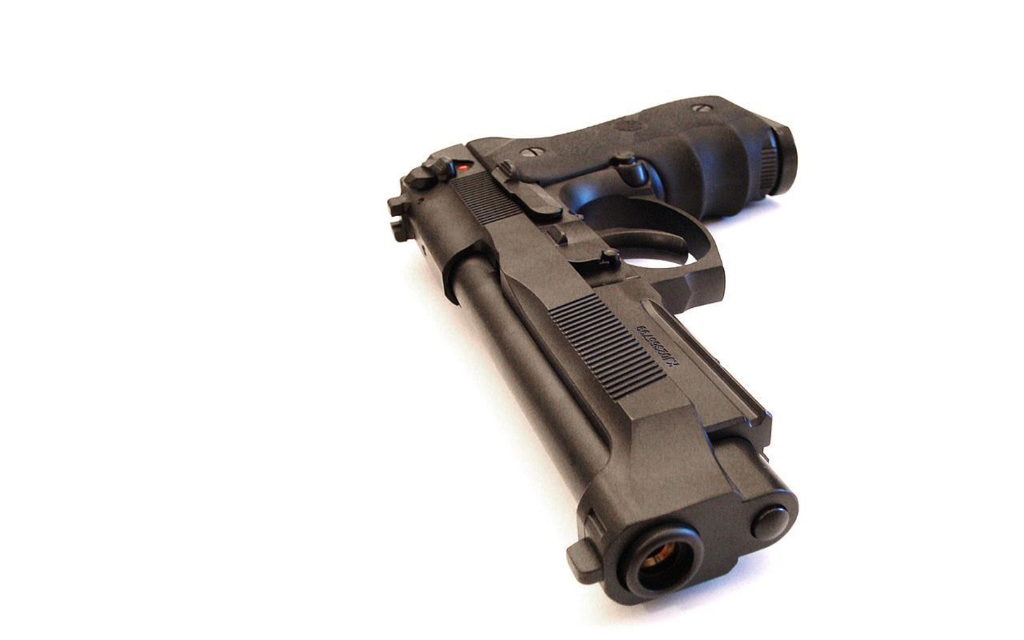 black handgun on white background