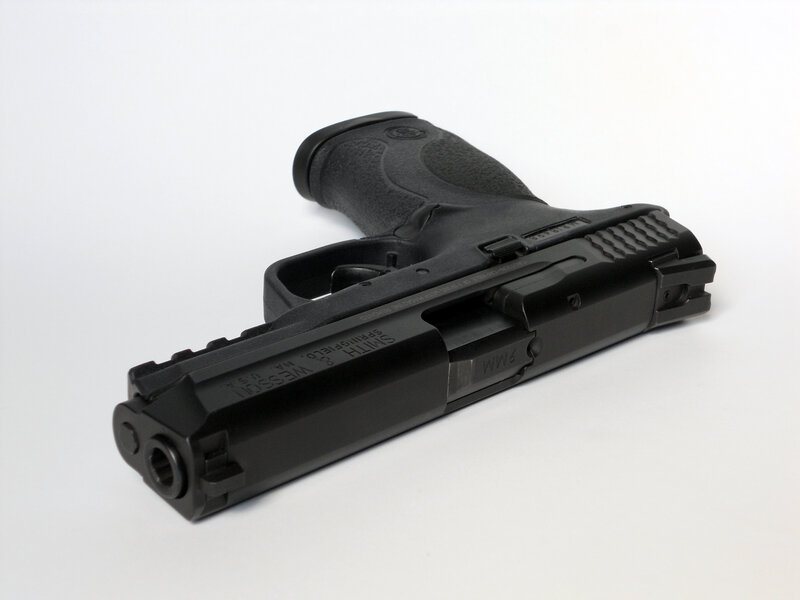 black handgun on white background