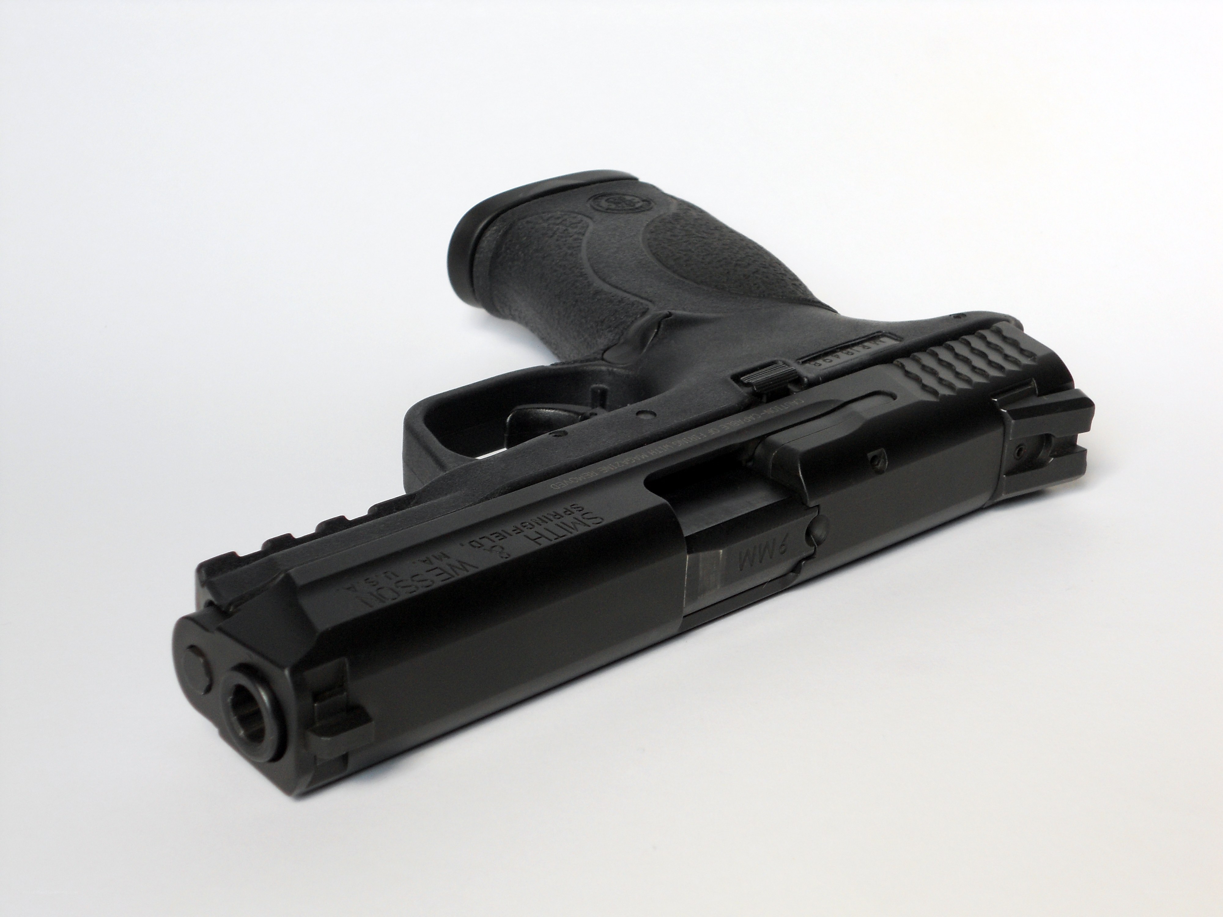 black handgun on white background