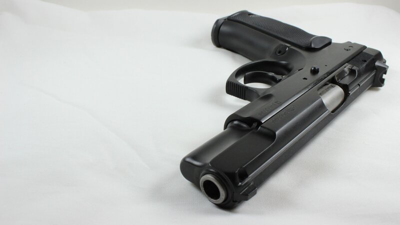 Black Handgun on White Surface — Neutral