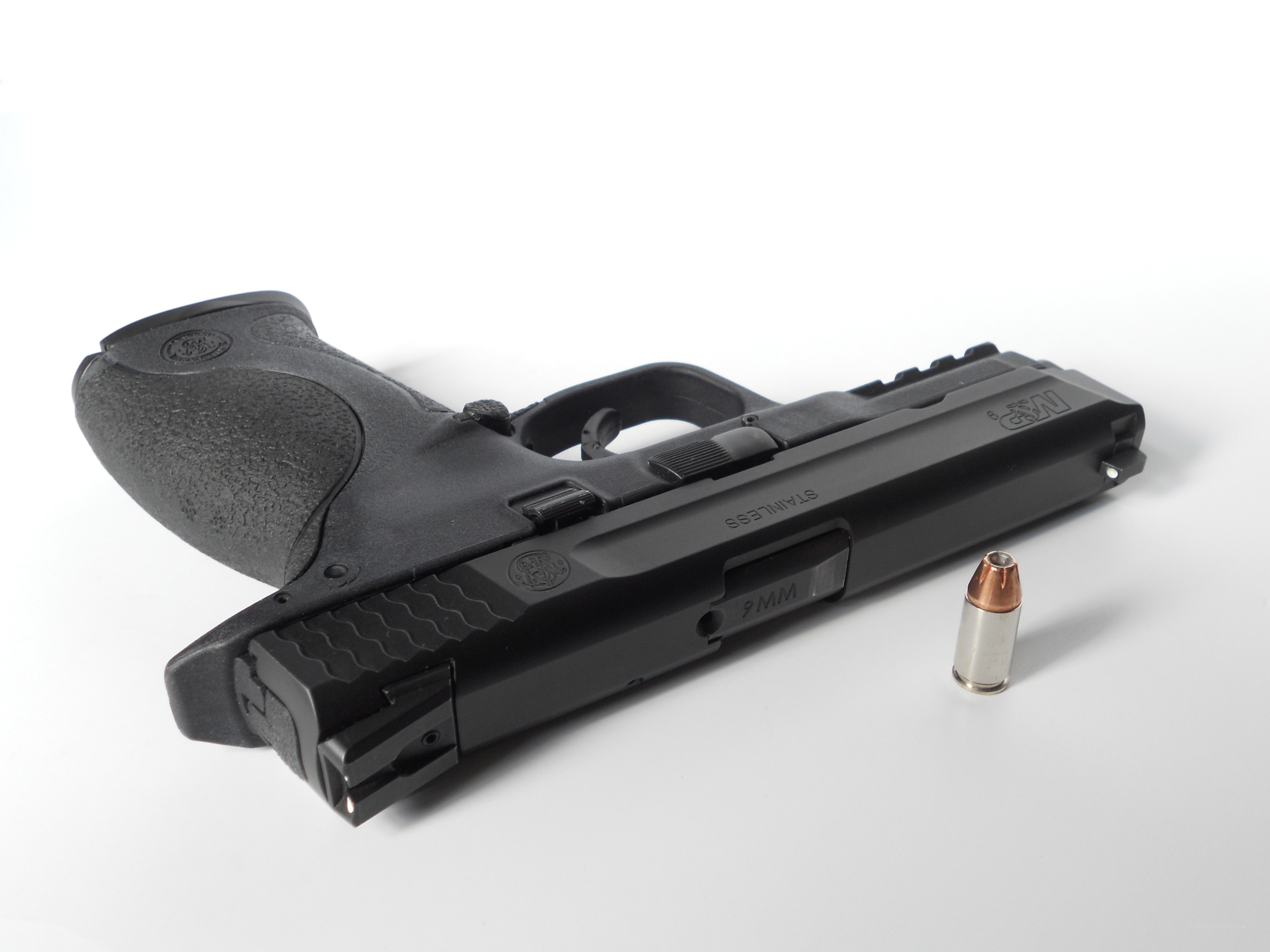 black handgun with bullet