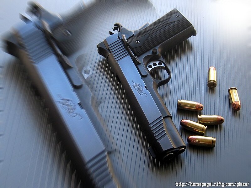 Black handgun with bullets