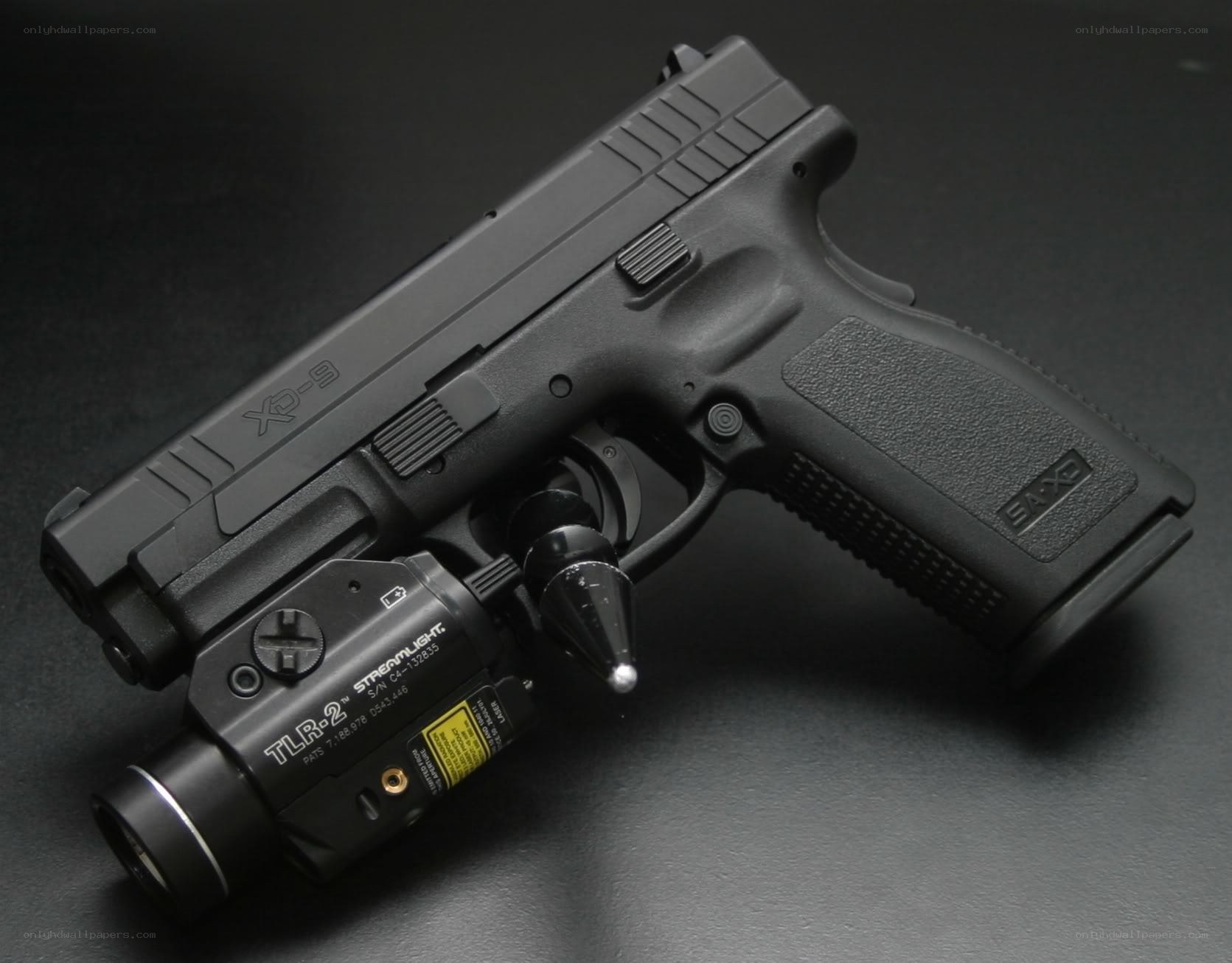 Black handgun with flashlight